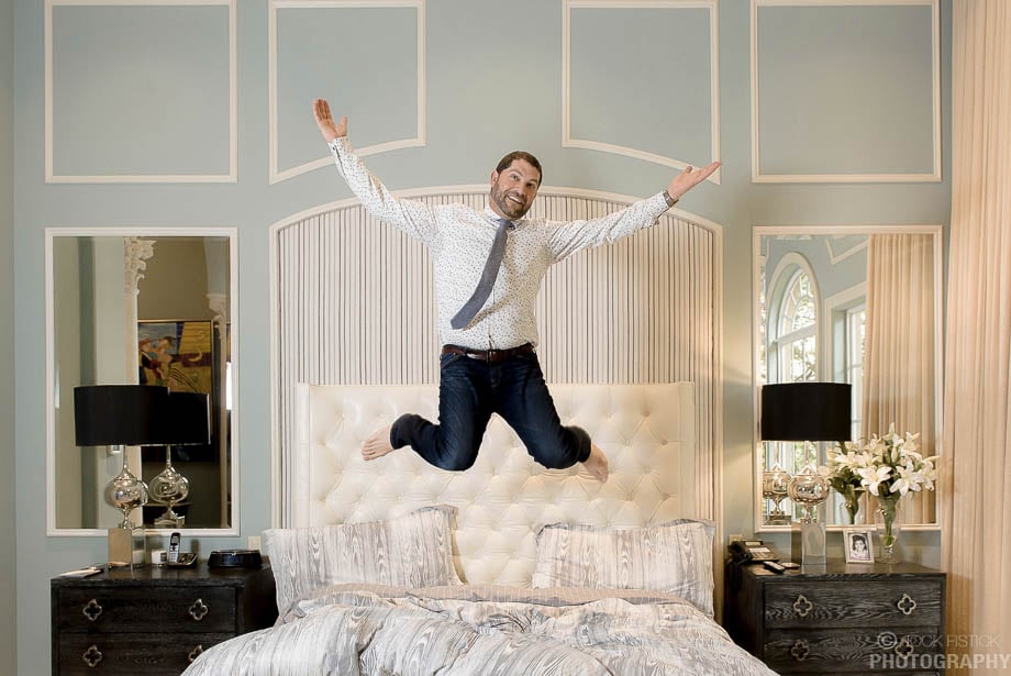 Photo of Greg Shugar jumping on a bed taken by Miami-based corporate photographer Jock Fistick. 