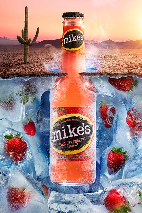 A conceptual photograph showing juxtaposition of a dry desert and the icy cool sensation of A Mike's Hard Strawberry Lemonade
