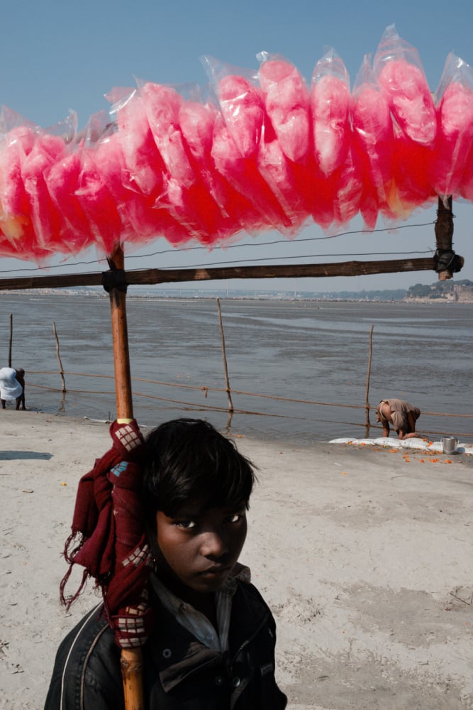 Photo by Kevin WY Lee of a boy selling cotton candy.