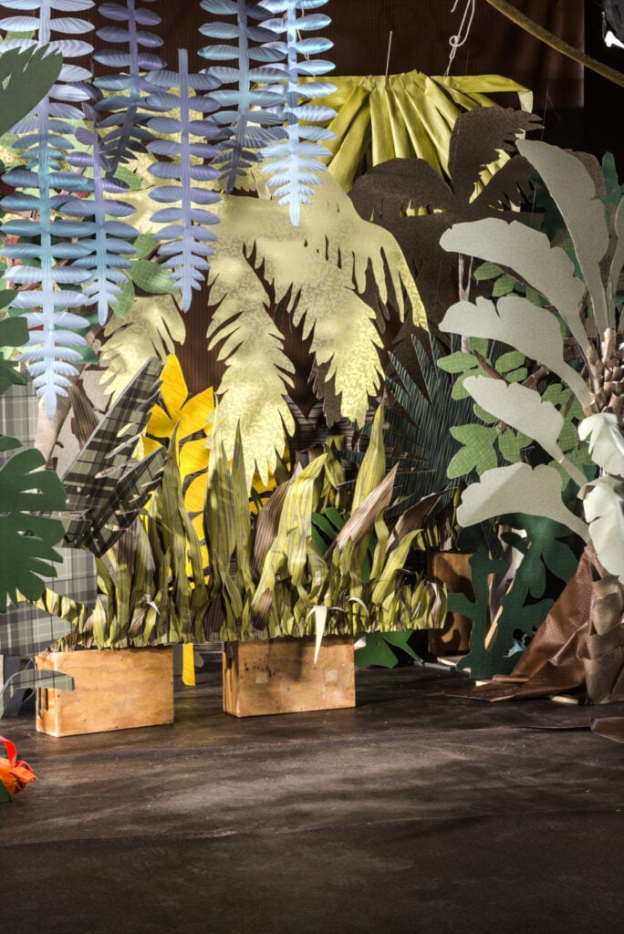 Behind the scenes image of a jungle scene set designed for a shoot.