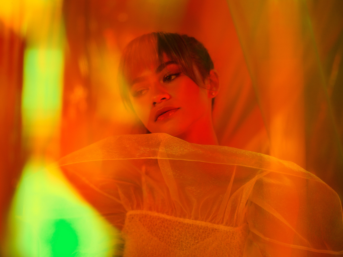 This captivating portrait of Zendaya, shot by Mark Leibowitz for HBO's show Euphoria, showcases the actress in a spectrum of vibrant hues, the vivid colors enhancing the visual allure and capturing the essence of her dynamic presence on screen.