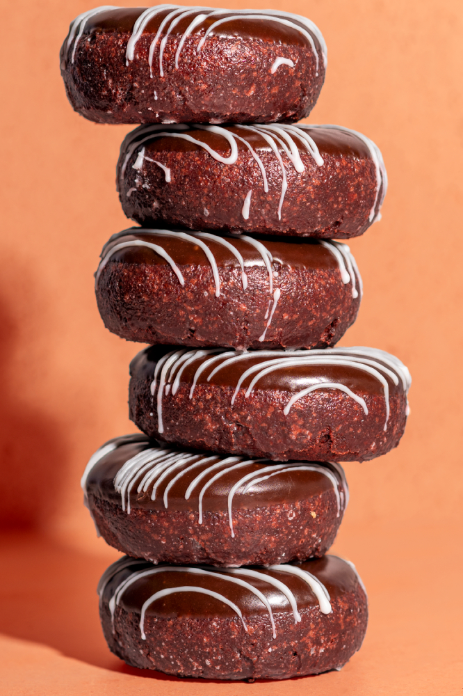 Photo by Max Cozzi of a stack of donuts.