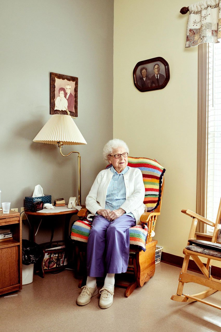 Michael Wilson's portrait of a woman sitting in a rocking chair in her bedroom for Down East magazine 