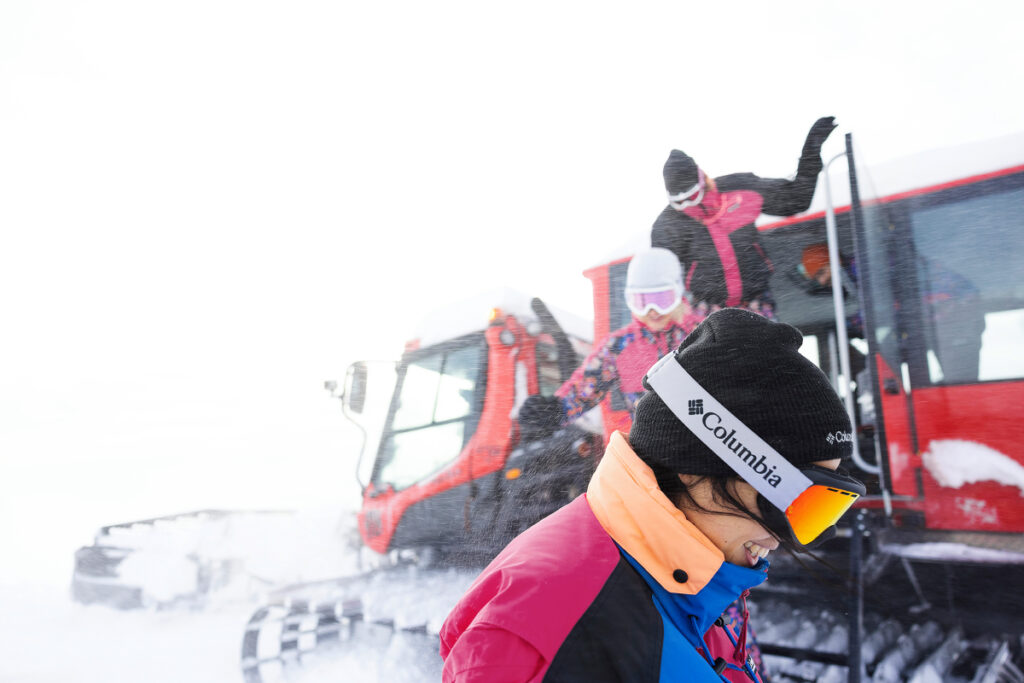 In the midst of a fierce winter storm, skiers dressed head to toe in Columbia Sportswear's Heritage Collection ski gear emerge from a Sno-Cat, image by Richard Darbonne.