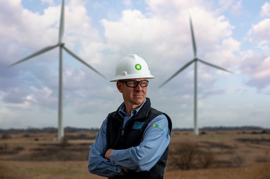 A portrait of BP's CEO, Bernard Looney against the landscape of the wind farm in Kansas. 