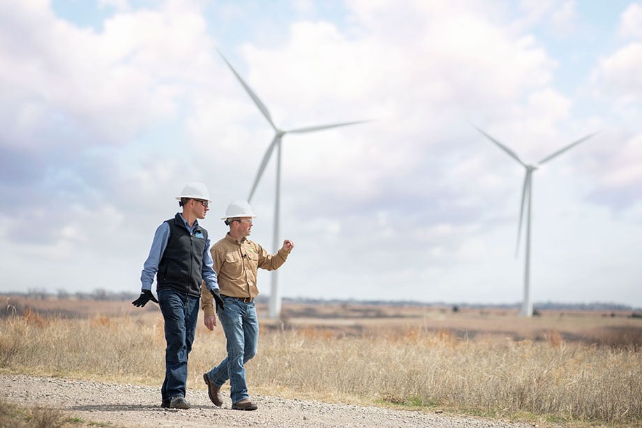 BP's CEO walks the grounds of the wind farm with another worker photographed by photographer Sean F. Boggs