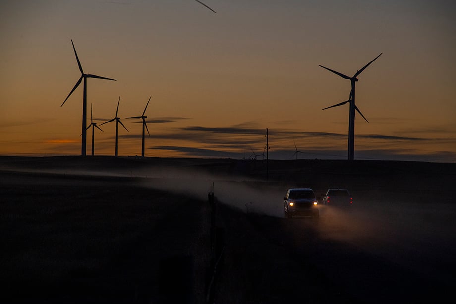 A landscape photograph of BP's Wind Farm, showing cars driving past photographed by industrial photographer Sean F. Boggs