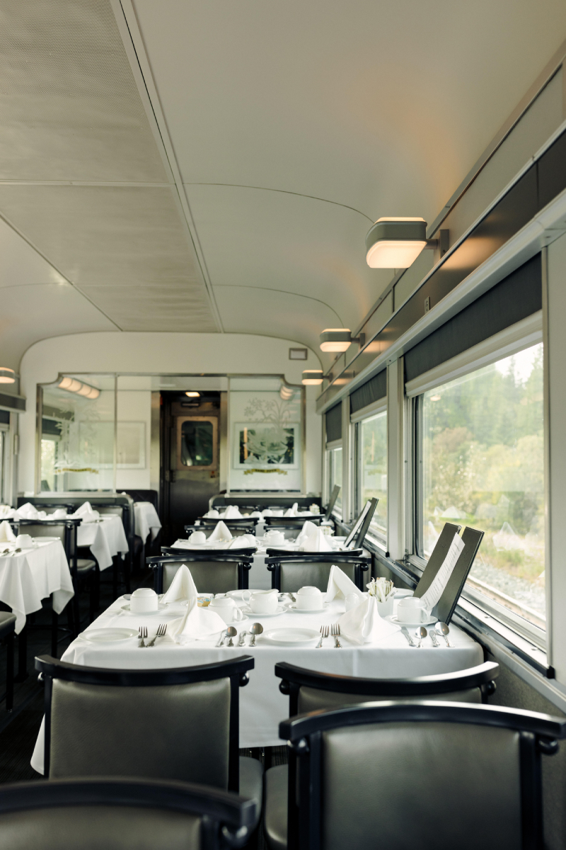A color photo by Taylor Roades of the interior of the train dining car.