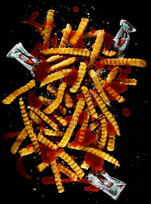 Messy fries and ketchup